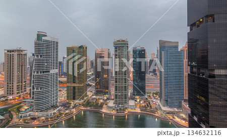Residential and office buildings in Jumeirah lake towers district night to day timelapse in Dubai Residential and office buildings in Jumeirah lake towers district night to day timelapse in Dubai 134632116