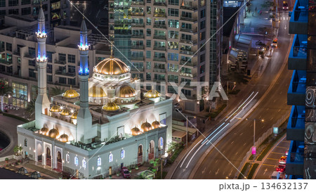 Modern residential architecture of Dubai Marina and Mohammed Bin Ahmed Almulla Mosque aerial night timelapse Modern residential architecture of Dubai Marina and Mohammed Bin Ahmed Almulla Mosque aerial night timelapse 134632137