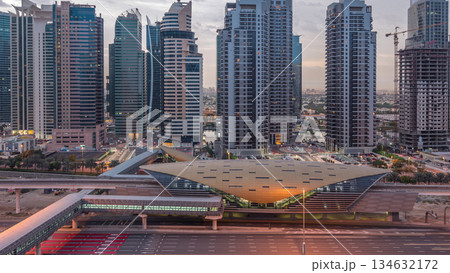Aerial top view to Sheikh Zayed road near Dubai Marina and JLT night to day timelapse, Dubai. 134632172