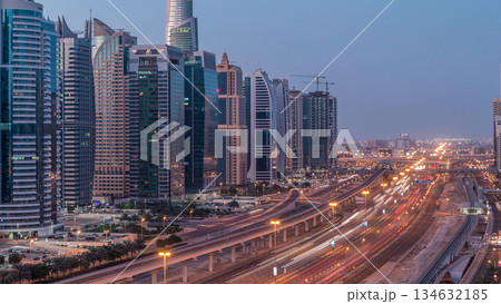 Aerial top view to Sheikh Zayed road near Dubai Marina and JLT night to day timelapse, Dubai. Aerial top view to Sheikh Zayed road near Dubai Marina and JLT night to day timelapse, Dubai. 134632185