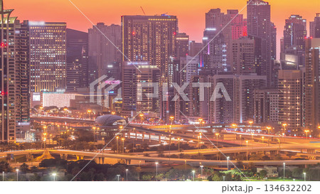 Dubai Marina skyscrapers and golf course day to night timelapse, Dubai, United Arab Emirates 134632202