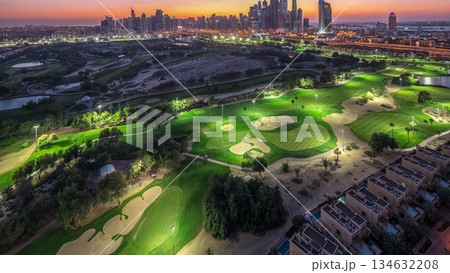 Dubai Marina skyscrapers and golf course day to night timelapse, Dubai, United Arab Emirates 134632208