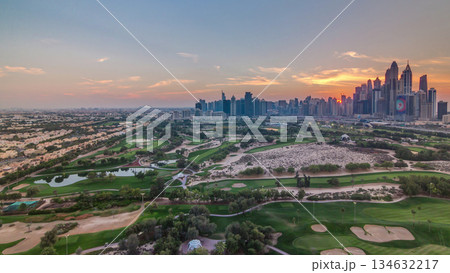 Dubai Marina skyscrapers and golf course sunset timelapse, Dubai, United Arab Emirates Dubai Marina skyscrapers and golf course sunset timelapse, Dubai, United Arab Emirates 134632217