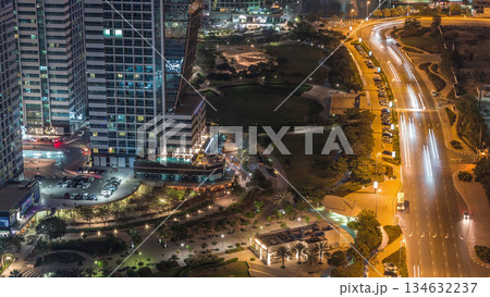 Jumeirah Lake Towers residential district aerial night timelapse near Dubai Marina 134632237