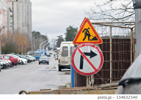Road work and no right turn traffic signs at construction site 134632340