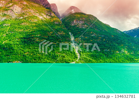 View of the glacial mountain lake Oldevatnet. Beautiful nature of Norway, Europe. View of the glacial mountain lake Oldevatnet. Beautiful nature of Norway, Europe. 134632781
