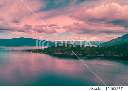 Fjord at sunset. Rocky coast in the evening. Hardanger Fjord. Beautiful nature of Norway 134632874