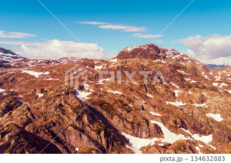 Peaks of the mountains, covered with melting snow. Nature park in Sauda municipality. Beautiful nature of Norway, Europe 134632883