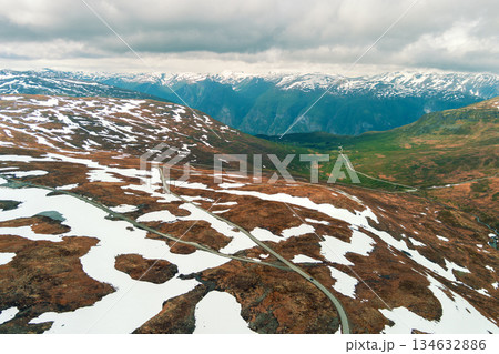 Aerial view of snow-covered mountain in summer. High mountain road Bjorgavegen. Aurlandsvegen, Aurland, Norway 134632886