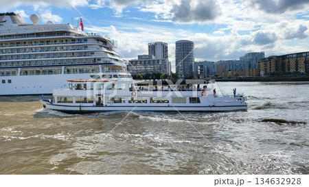 This is river thames london with white cruise liner at the way This is river thames london with white cruise liner at the way 134632928