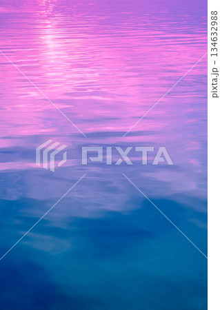 Sea water surface. View from above. Artistic pink-blue gradient color. Vertical banner Sea water surface. View from above. Artistic pink-blue gradient color. Vertical banner 134632988