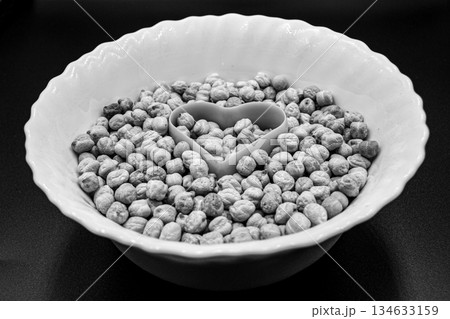 Beautiful organic dried chickpea beans consisting of raw bengal legume pea 134633159