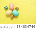 Painted Easter eggs on yellow background. Happy Easter.  134634746