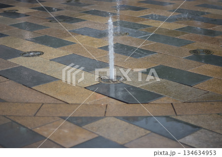 Water Fountain Jet on Tiled Ground Water Fountain Jet on Tiled Ground 134634953