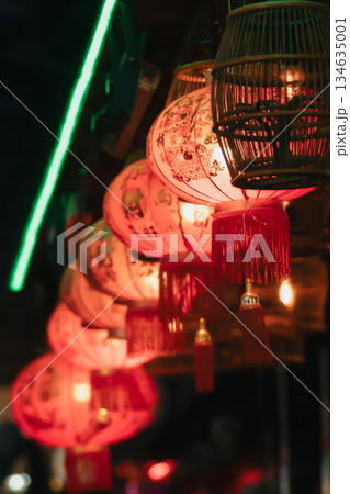 Traditional red Chinese paper lanterns hang in a row. Lantern Festival or the celebration of the secret of autumn. High quality photo 134635001