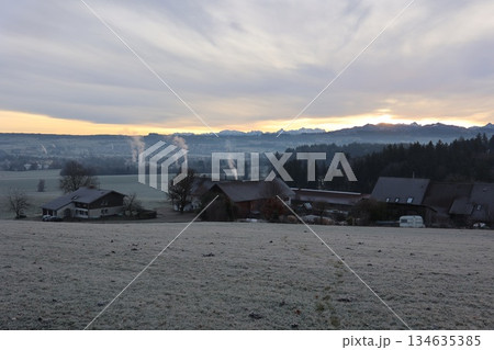 Frosted Rural Landscape with Mountain Range at Sunrise Frosted Rural Landscape with Mountain Range at Sunrise 134635385