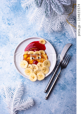 Pancakes in the shape of Santa Claus 134635574