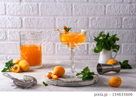 Fresh apricot Bellini cocktail with mint Fresh apricot Bellini cocktail with mint 134635606