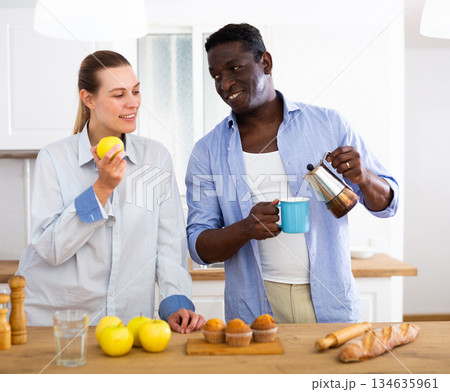 Preparing breakfast and coffee in happy family Preparing breakfast and coffee in happy family 134635961