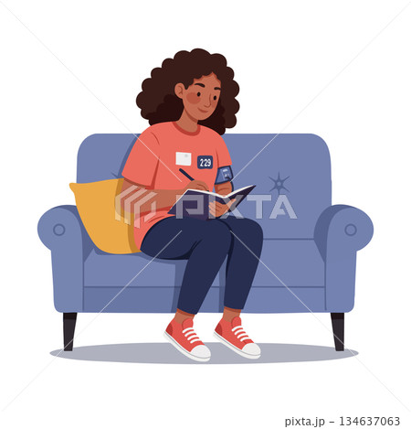 Woman with curly hair journaling on blue sofa with orange pillow and red sneakers Woman with curly hair journaling on blue sofa with orange pillow and red sneakers 134637063