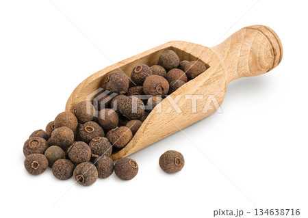 Allspice pepper in wooden scoop isolated on white background. Jamaica pepper, Pimenta dioica or myrtle pepper. 134638716