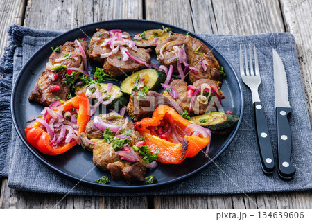 Grilled pork neck chunks with roasted veggies Grilled pork neck chunks with roasted veggies 134639606