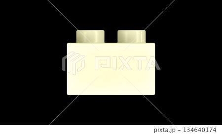 Cream Plastic Building Block Isolated on a Black Background. Cream Plastic Building Block Isolated on a Black Background. 134640174