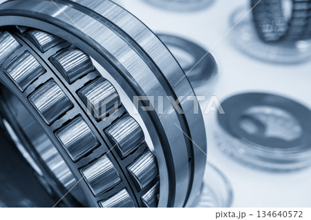Close up scene the conical cylindrical bearing in the light blue scene with light effect. Close up scene the conical cylindrical bearing in the light blue scene with light effect. 134640572