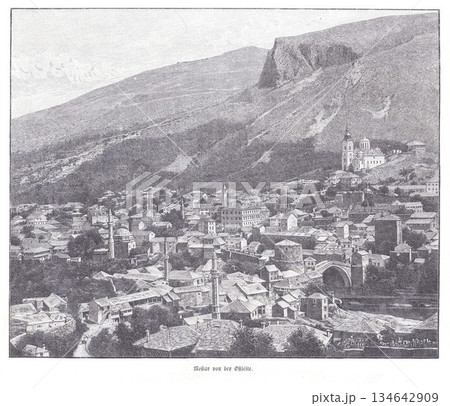 Mostar Old Town With Stone Bridge And Hillside Church Spires Seen From Elevated View Mostar Old Town With Stone Bridge And Hillside Church Spires Seen From Elevated View 134642909