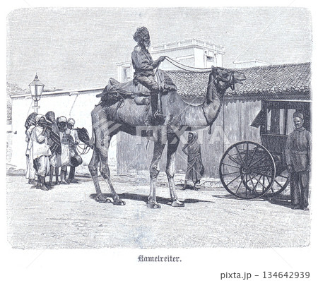 Camel Rider in India, 1888: A Vintage Street Scene with Mounted Traveller, Local Onlookers, and a Wooden Cart Along a Bustling Town Street 134642939