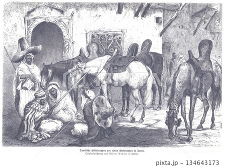 Historic Tunisian Street Scene With Horses And Traders In Traditional Robes In A Medina 134643173