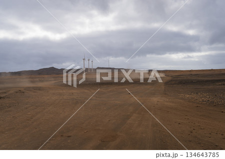 Panoramic view of three wind turbines in a Cape Verde desert Panoramic view of three wind turbines in a Cape Verde desert 134643785