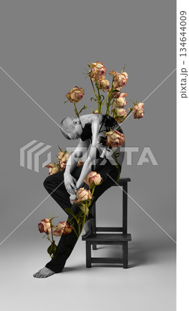 Graphic artwork of seated male figure with rose collage. Graphic artwork of seated male figure with rose collage. 134644009