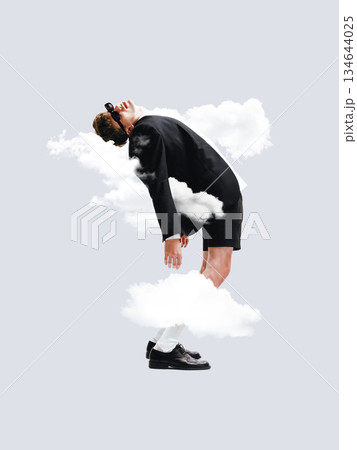 Minimal surreal composition with man floating among clouds 134644025