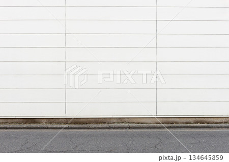 street wall background ,Industrial background, empty grunge urban street with warehouse brick wall street wall background ,Industrial background, empty grunge urban street with warehouse brick wall 134645859