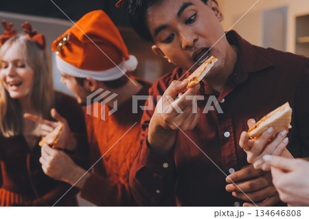 Festive Office Christmas Party with Delicious Food. A beautifully decorated office space with Christmas trees and festive lights, set up for a holiday party. 134646808