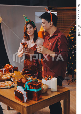 Festive Office Christmas Party with Delicious Food. A beautifully decorated office space with Christmas trees and festive lights, set up for a holiday party. Festive Office Christmas Party with Delicious Food. A beautifully decorated office space with Christmas trees and festive lights, set up for a holiday party. 134646820