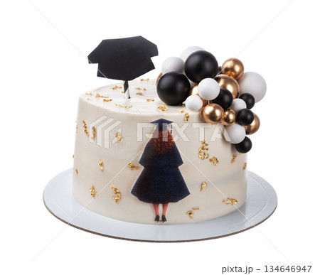 A beautifully designed cake celebrates graduation with a cap topper and elegant decorations in black, white, and gold. Perfect for any graduation party 134646947