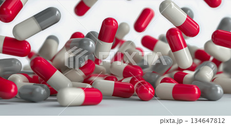 白背景に舞う赤白カプセルの医療コンセプト背景 134647812