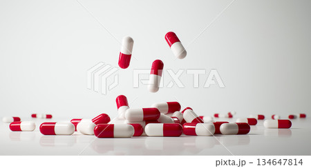 白背景に舞う赤白カプセルの医療コンセプト背景 134647814