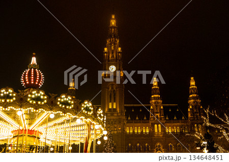 Christmas Card Night Shining City with Town Hall and Carousel, Christmas Market. Christmas Card Night Shining City with Town Hall and Carousel, Christmas Market. 134648451
