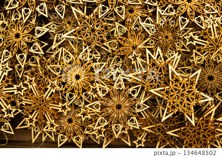 Eco-friendly Christmas decorations made of natural wood, wooden snowflake ornaments. 134648502