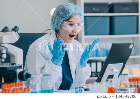 Portrait, science and happy woman on laptop in lab to research chemistry, test or innovation. Microscope, scientist and face of medical doctor in goggles for microbiology, healthcare or pharma study Portrait, science and happy woman on laptop in lab to research chemistry, test or innovation. Microscope, scientist and face of medical doctor in goggles for microbiology, healthcare or pharma study 134648800