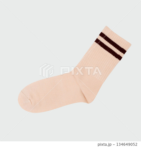 Beige sock with brown stripes on white background 134649052