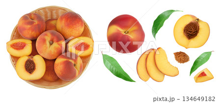 Ripe peach fruit with half in a wicker basket isolated on white background with full depth of field. Top view. Flat lay 134649182