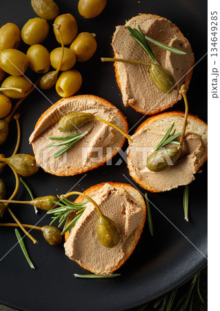 Sandwiches with pate on a black plate. Sandwiches with pate on a black plate. 134649285