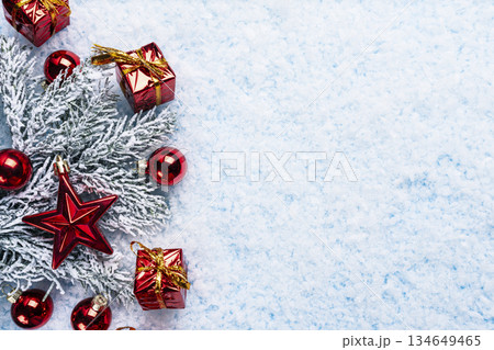 Festive Christmas composition with red ornaments, shiny gift boxes, 134649465