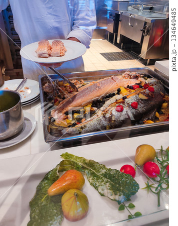 Dining Room Buffet aboard the abstract luxury cruise ship. Healthy food at modern liner concept Dining Room Buffet aboard the abstract luxury cruise ship. Healthy food at modern liner concept 134649485