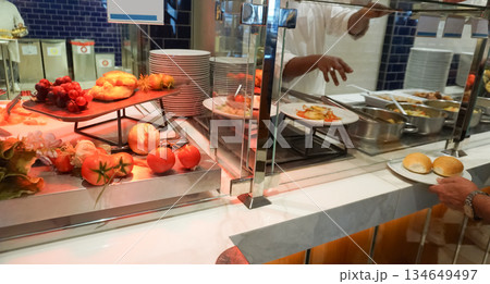 Dining Room Buffet aboard the abstract luxury cruise ship. Healthy food at modern liner concept 134649497