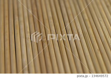 Thin round bamboo sticks are used as supports for indoor or for cooking, thin long sticks made of bamboo have a wide range of applications from cooking Thin round bamboo sticks are used as supports for indoor or for cooking, thin long sticks made of bamboo have a wide range of applications from cooking 134649572